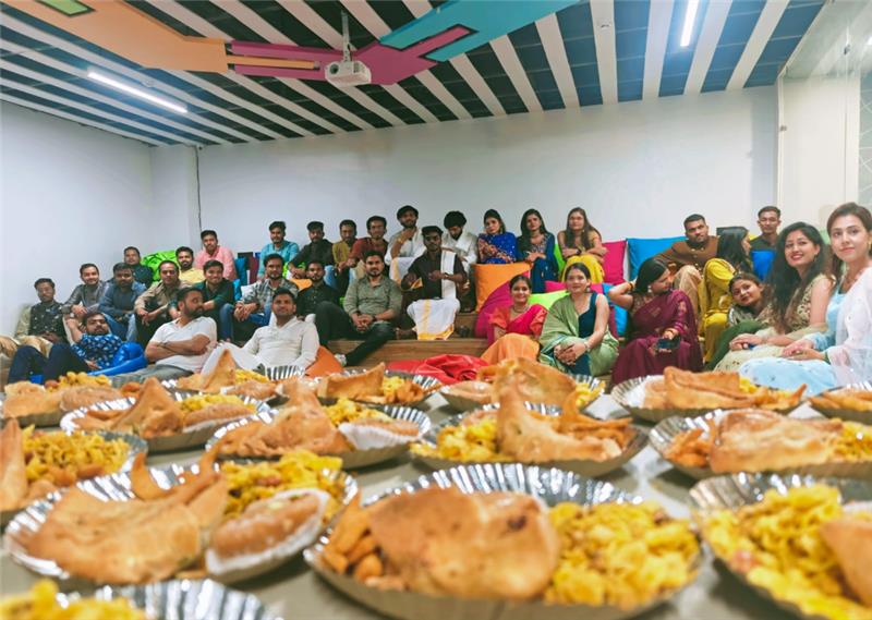 Group of people sitting with food plates